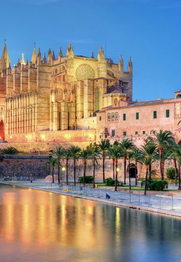 Cathedral of Palma de Majorca reflecting on the water at evening