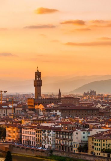 Florence city during golden sunset. Panoramic view to the river Arno, with Ponte Vecchio, Palazzo Vecchio and Cathedral of Santa Maria del Fiore (Duomo), Florence, Italy