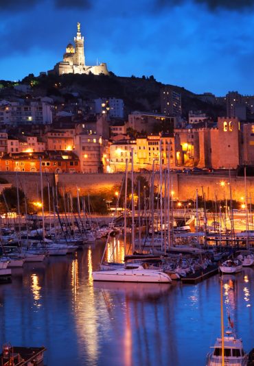 Marseille, France panorama at night. The famous european harbour view on the Notre Dame de la Garde