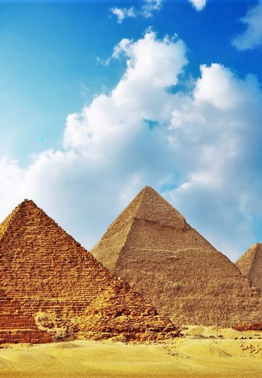 Giza valley with Great pyramids with blue cloudy sky